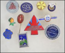 A small group of vintage pin badges to include a hallmarked silver The Girls Life Brigade long