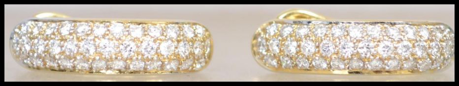 A stunning pair of 18ct gold and diamonds ladies earrings with pave set diamonds totalling approx