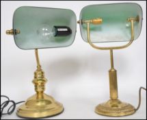A near pair of 20th century green glass and brass bankers desk lamp having glass rectangular