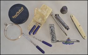 A vintage silver S Mordan & Co propelling pencil together with a white metal propelling pencil, a