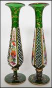 A pair of Bohemian green glass single stem solifleur vases of reversed tapering form with waisted