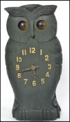 A believed 20th century Black Forest style clock in the form of an owl with articulating eyes.
