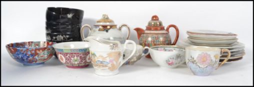 A group of Oriental ceramics to include various cups and saucers, teapots, Imari Bowl etc. Please