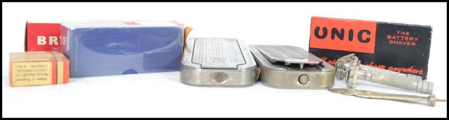 A collection of vintage razors and shaving items to include two cased Rolls Razors a Merkur