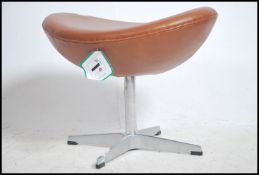 After Arne Jacobsen. A polished steel and tan brow