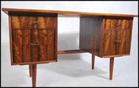 A retro 20th century teak and chrome twin pedestal