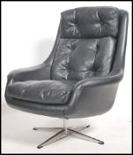 A 1960's Parker Knoll large batwing swivel egg cha