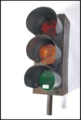 A vintage early 20th century traffic light having