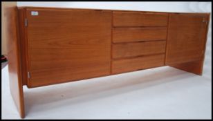 A 1970's Danish sideboard raised on turned legs wi