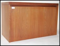 A retro mid century Beaver & Tapley teak wood wall