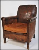 A 1930's Art Deco leather French club armchair rai