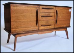 A stunning mid century Alfred Cox sideboard in tea