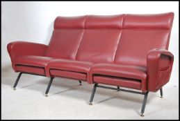 A good 1970's Italian red faux leather upholstered
