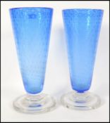 A stunning pair of mid century blue glass control