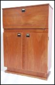 A good 1970's teak wood cocktail cabinet raised on