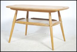 A rare vintage Ercol butler / tray table designed