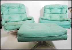A pair of original retro mid century swivel lounge