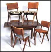 A stunning 1960's teak wood dining table and 6 cha