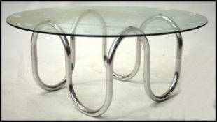 A 1970's retro chrome and glass circular coffee ta