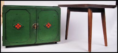 A vintage mid century wooden painted first aid cup