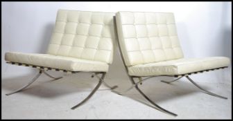 A pair of leather and polished steel Barcelona cha