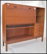 A 1970's teak wood Danish influence highboard side