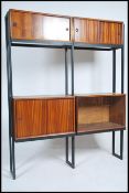 A 1970's Modular teak wood twin section wall unit