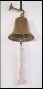 A good mid century brass school bell with wall mou