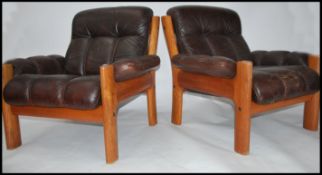 A retro pair of Scandinavian brown leather upholst