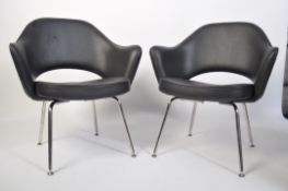 After Eero Saarinen, a pair of black faux leather