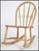 A vintage mid century Ercol beech and elm rocking