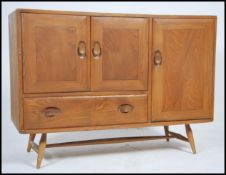 A good mid century Ercol Windsor pattern sideboard