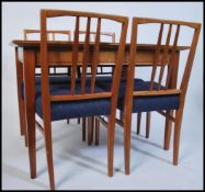 An original Gordon Russell walnut extending dining