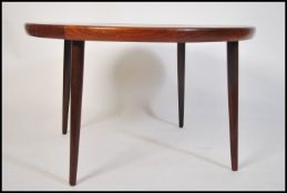 A retro mid century teak wood circular atomic styl