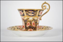 A Royal Crown Derby cup and saucer in the 2451 Ima