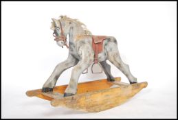 A vintage 20th century 1950s child's rocking horse