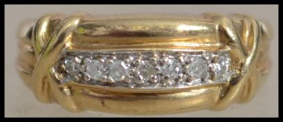 A hallmarked 9ct gold and diamond  band ring with
