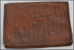 A vintage ladies crocodile skin clutch bag having