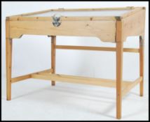 A 20th century stripped pine shop / museum display