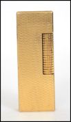 A vintage 20th century Dunhill gilt metal Swiss li