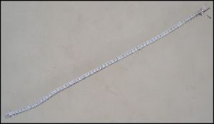 A contemporary ladies silver and cz adorned line b