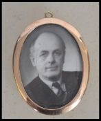 An early 20th century double sided 15ct gold twin