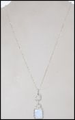 A silver ladies opal and cz adorned pendant comple