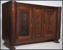 A large early 20th century Art Deco oak sideboard