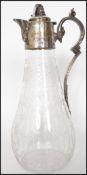 A Georgian cut glass claret jug having a silver pl