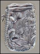 A silver contemporary vesta case having a hinged t