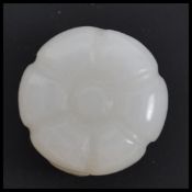 A believed Republic period white jade button, in t