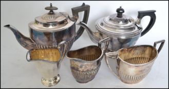 Two silver plate tea services one being an Elkingt