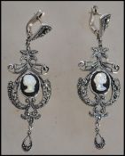 A pair of ladies silver and marcasite adorned Art