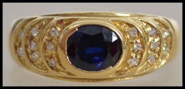 A 20th century yellow gold sapphire and diamond ri